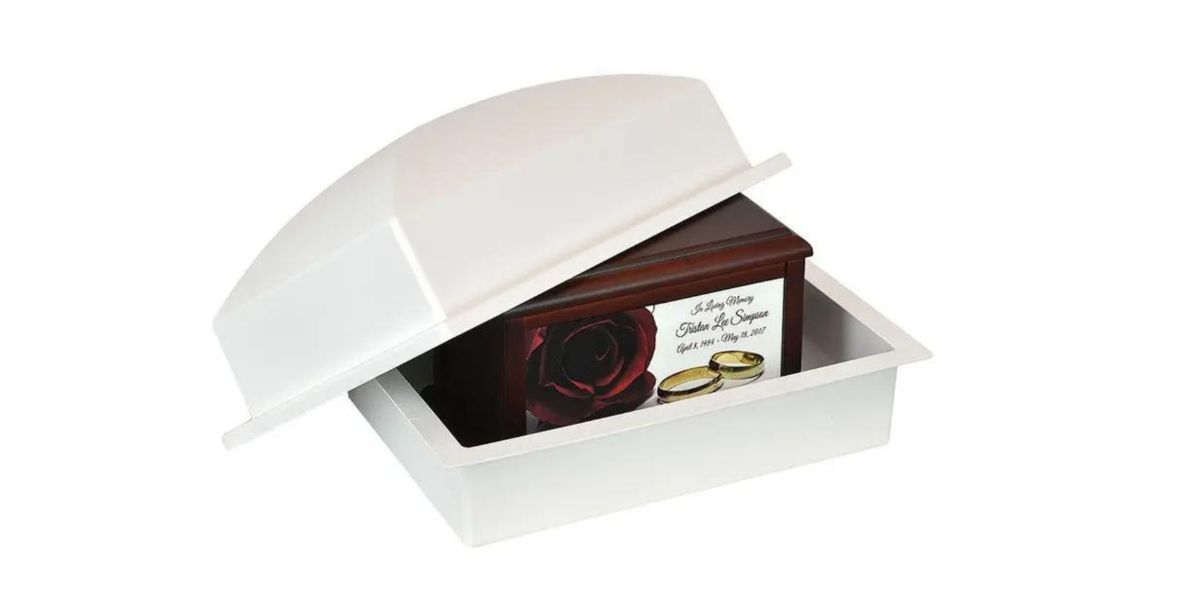 Urn vault with a custom Keep The Memory urn inside.
