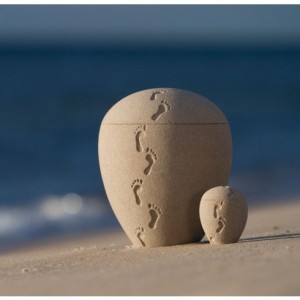 Footprints in the sand natural cremation urn.