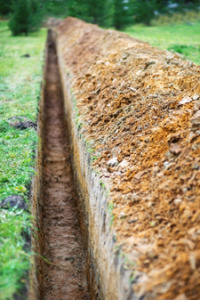 Long, shallow trench created for trenching cremated remains.