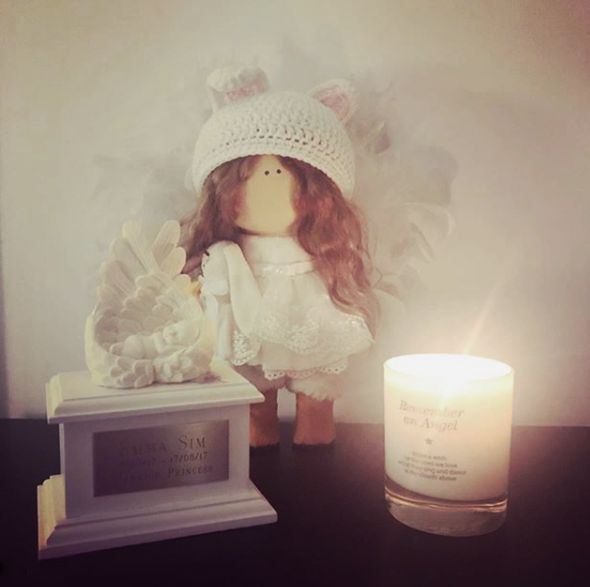 Altar for a passed child with a candle.