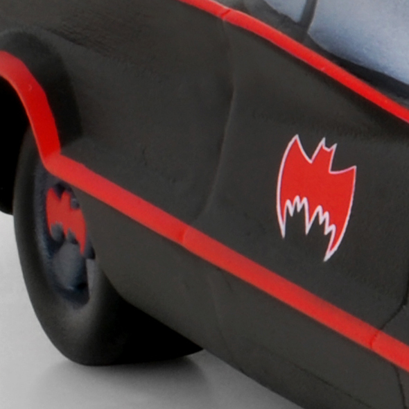 A close-up showing a red bat logo on the 3D-printed custom cremation urn.
