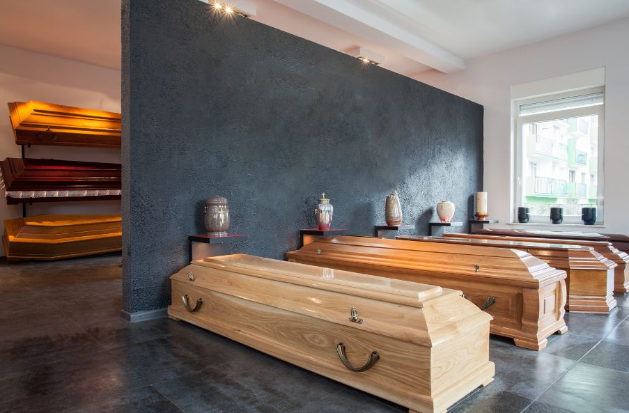 4 wooden caskets on display.