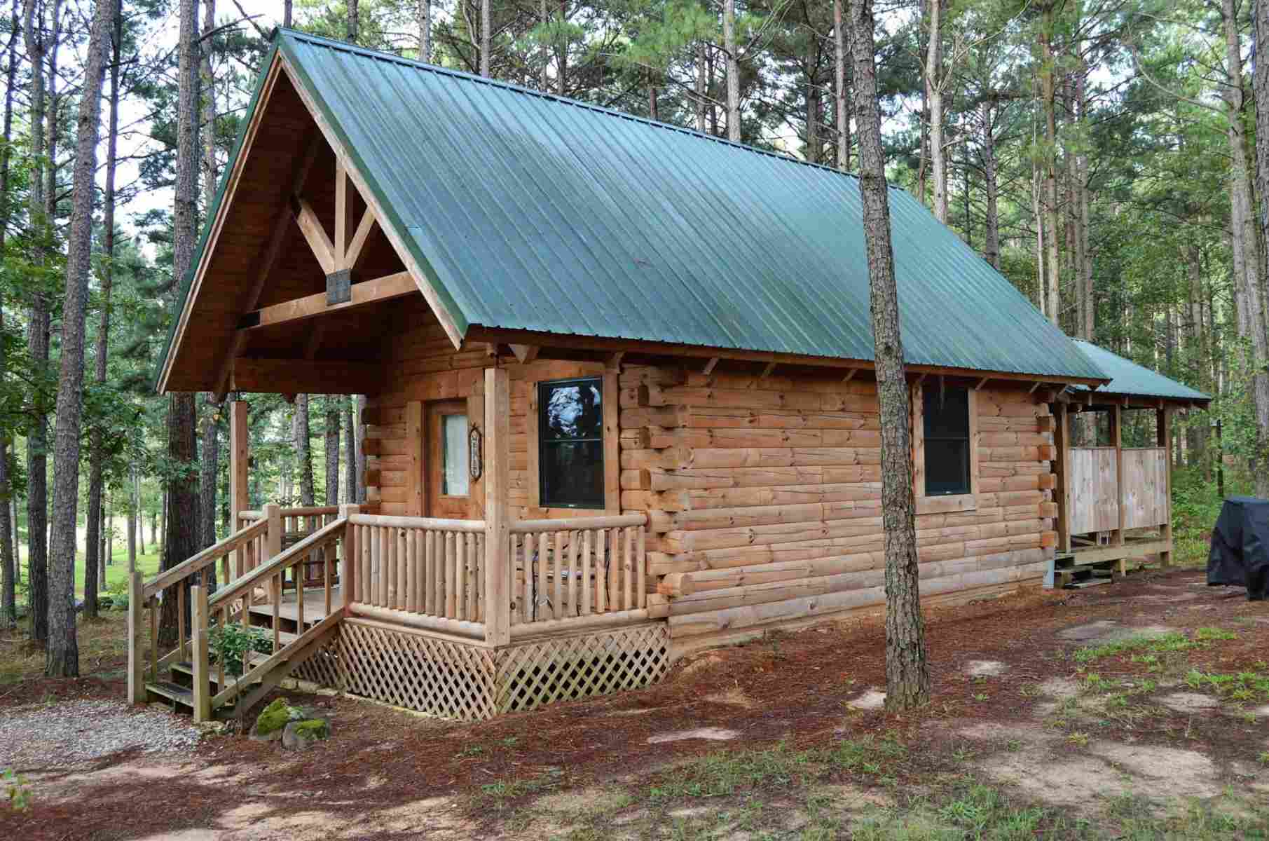 Well-built log cabin in the woods.