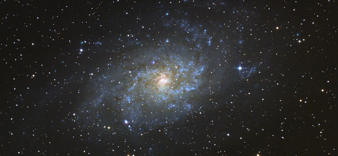Outer space image of a spiral galaxy.