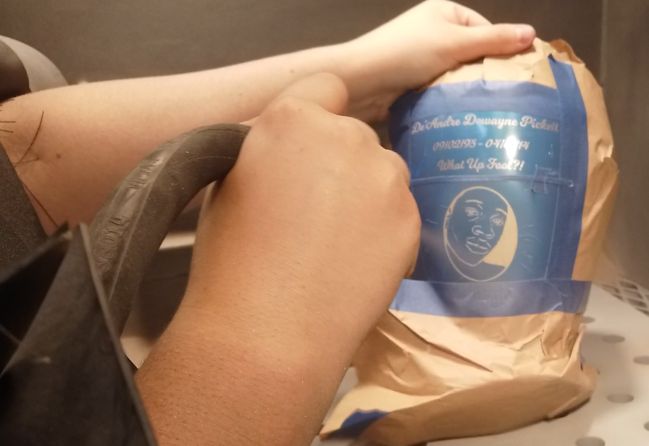 Sand blasting cremation urn.