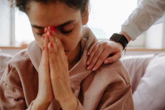 Young woman praying.