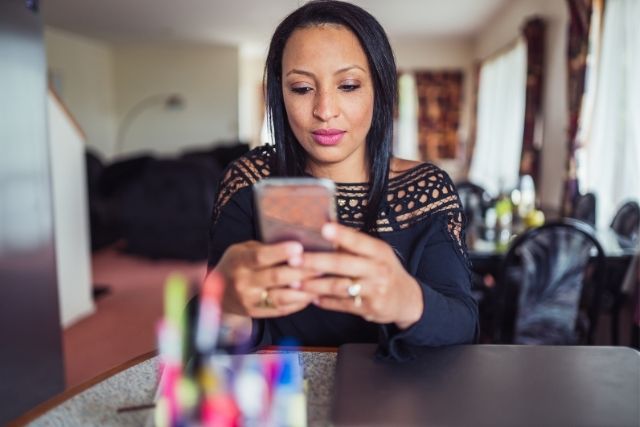 Woman ordering meal delivery from her phone.