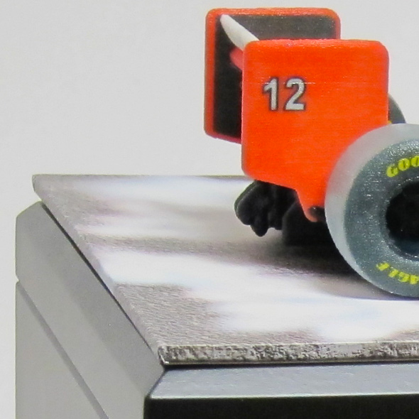 A close-up of the back spoiler of the 3D-printed McLaren-Honda racecar.