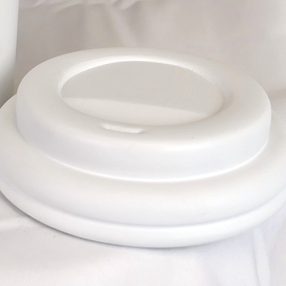The 3D-printed lid of the custom urn, shaped like the lid of a Starbucks paper cup.