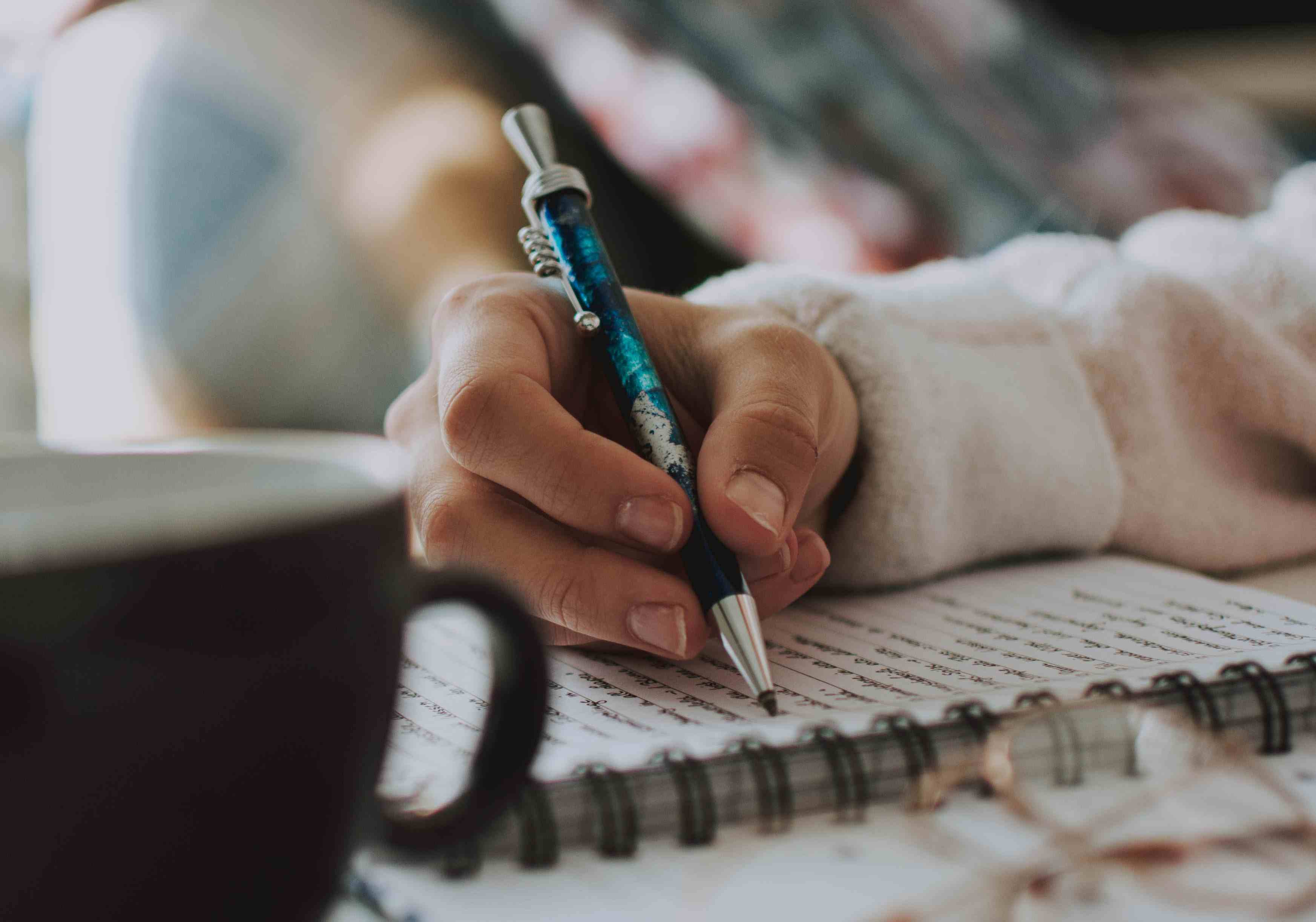 Writing a eulogy in a journal.